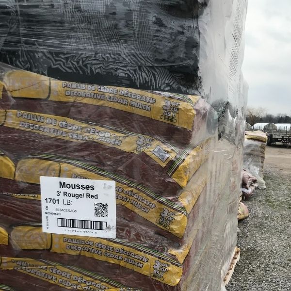 pallet of bags of red cedar mulch wrapped in plastic at the Bay Landscaping nursery