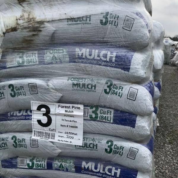 stack of bags full of pine bark mulch at the Bay Landscaping nursery