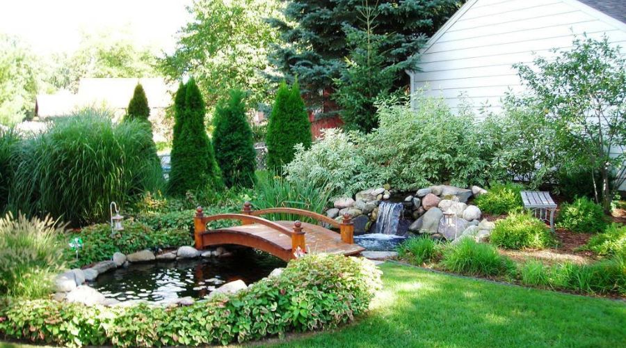 A Michigan property designed by Bay Landscaping with a water feature.
